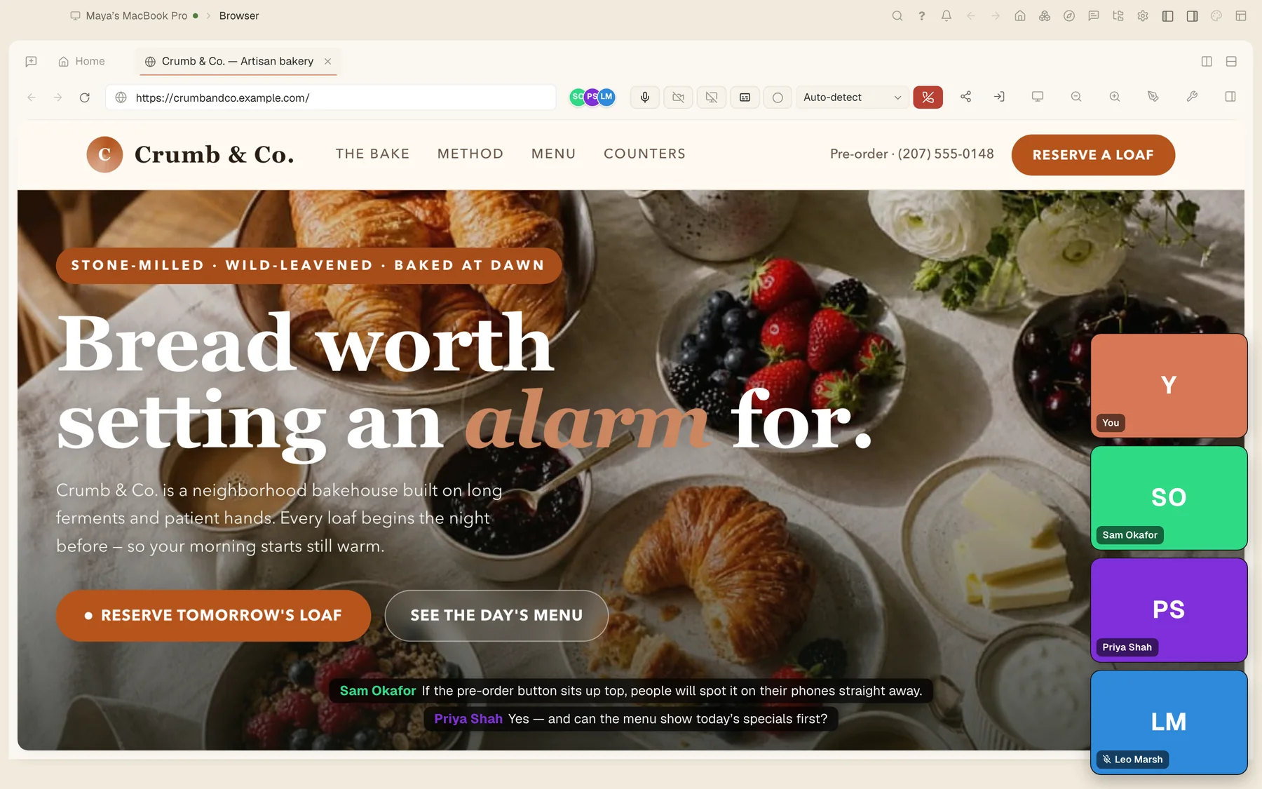 A huddle with four people reviewing the bakery website.
